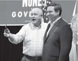  ?? SCOTT WHEELER The Ledger ?? United States Secretary of Agricultur­e Sonny Perdue tells the audience to get a picture of him and Ron DeSantis during a rally in Lakeland.