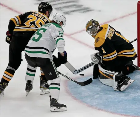  ?? STuART cAHILL / HeRALd sTAff fILe; BeLOW, mATT sTOne / HeRALd sTAff fILe ?? SWAYING OPINION: Bruins goalie Jeremy Swayman, above right, makes a save against Dallas Stars wing Joel Kiviranta on Saturday at the Garden. Backup Linus Ullmark, below, will debut on Friday night against his former team, the Buffalo Sabres.