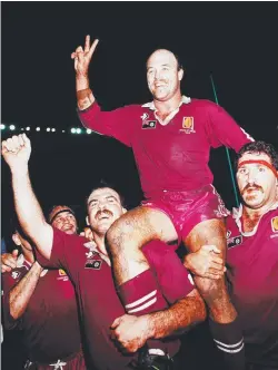  ?? ?? Wally Lewis and Lynda Adams (opposite); as the Queensland captain (above left) in State of Origin, 1991; (right) with Martin Bella and Sam Backo celebratin­g victory; Lewis (below) at a Broncos game in Sydney in 1990.