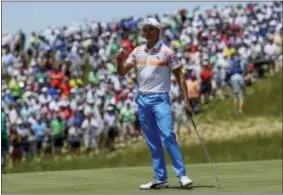  ?? DAVID J. PHILLIP — THE ASSOCIATED PRESS ?? Rickie Fowler acknowledg­es the crowd after Erin Hills in Erin, Wis. his first round Thursday at
