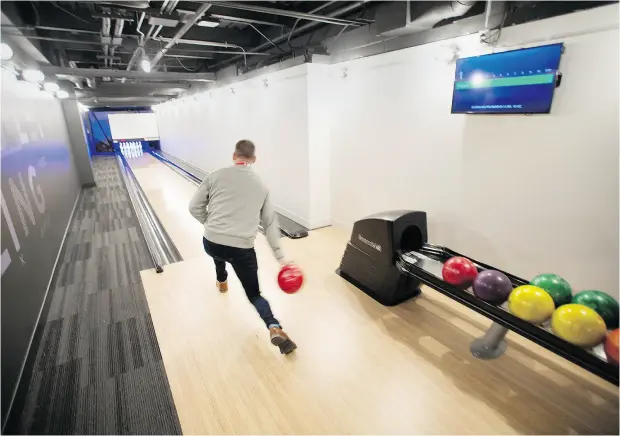  ?? PETER J. THOMPSON / NATIONAL POST ?? SVP Digital Banking Jeff Marshall uses the bowling alley at the Scotiabank “digital factory” in downtown Toronto.