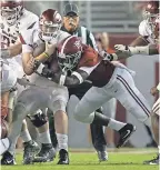  ?? MARVIN GENTRY/USA TODAY SPORTS ?? Alabama linebacker Jamey Mosley wraps up Arkansas’ Cole Kelley for one of his 12 tackles this season.