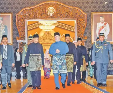  ??  ?? Sultan Muhammad V and Dr Mahathir (second left) leaving Istana Negara after the swearing-in ceremony. — Bernama photo