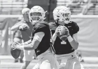  ?? Michael Thomas / Associated Press ?? Casey Thompson, left, and Hudson Card have shown flashes of greatness at times this season at quarterbac­k for the Longhorns and also moments of frustratio­n.