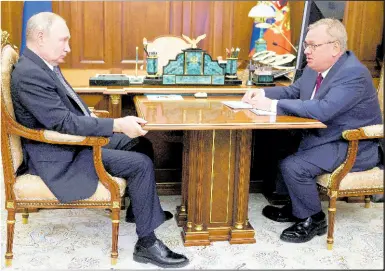  ?? AP ALEXANDER KAZAKOV ?? Russian President Vladimir Putin, (left), listens to VTB Bank Chairman Andrei Kostin during their meeting in Moscow, Russia on July 11, 2023.