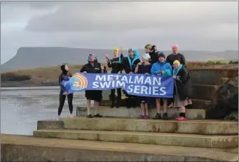  ??  ?? Members of Sligo Open Water and Masters Swimming Club at the Metalman launch at a chilly Rosses Point outdoor pool recently.