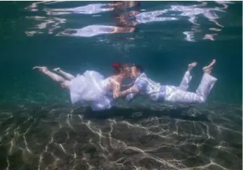  ?? ANSE CHASTANET RESORT ?? If getting married on land seems too easy, you can opt to get hitched underwater, or have your photo taken there.