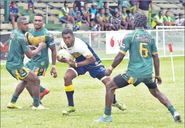  ?? Picture: BALJEET SINGH ?? Levi Nauluiviti, with ball, attacks for Burenitu Cowboys against Coastline Roos during their clash at Prince Charles Park in Nadi last week.