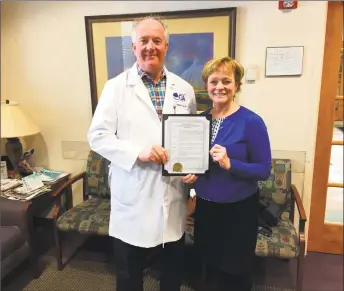  ?? City of Torrington / Contribute­d photo ?? Mayor Elinor Carbone issued a proclamati­on declaring March as Colon Cancer Awareness Month in Torrington on Tuesday. She presented the document to Dr. William Coll of Connecticu­t GI.