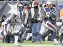 ??  ?? Deion Branch (right) has contribute­d 103 yards and a touchdown on five receptions — including a 61-yard score — during the Patriots’ run to the Super Bowl this season.