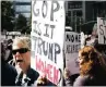  ??  ?? People gather for a protest by the National Organisati­on of Women against statements about women made by Donald Trump.