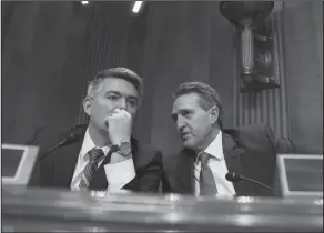  ?? AP Photo/J. Scott Applewhite ?? Cuba: Sen. Cory Gardner, R-Colo., left, and Sen. Jeff Flake, R-Ariz., confer as the Senate Foreign Relations Subcommitt­ee on the Western Hemisphere examines attacks on American diplomats in Havana, on Capitol Hill in Washington, Tuesday.