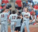  ?? SARAH PHIPPS/THE OKLAHOMAN ?? Oklahoma State’s Colin Brueggeman­n (12) reacts after a grand slam against the University of Oklahoma in Norman in 2023.