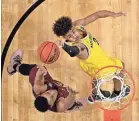  ?? BOB DONNAN/USA TODAY SPORTS ?? Michigan freshman Jordan Poole, shooting against Loyola-Chicago’s Marques Townes in the semifinals, made the buzzer-beating winning shot against Houston in the Round of 32.