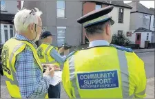  ??  ?? n TAKING ACTION: Volunteers and PCSOs are working to reduce speeding on Hillingdon’s roads