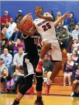  ?? PETE BANNAN — DIGITAL FIRST MEDIA ?? Plymouth Whitemarsh’s Ahmad Williams (25) is blocked by Coatesvill­e’s Tyrel Bladen in recent action.
