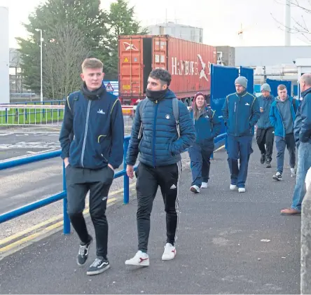  ?? Left : Staff leaving at the end of their shift; right: Economy Secretary Derek MacKay at a meeting in Enterprise House about the future of the Michelin factory. Pictures: Kim Cessford/Steve MacDougall. ??