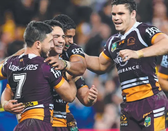  ?? UNBRIDLED JOY: Brisbane’s Kodi Nikorima ( celebrates scoring a try with teammates last night. Picture: AAP ?? second from left)
