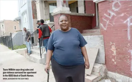  ?? BRIAN JACKSON/FOR THE SUN-TIMES ?? Taura Willhite says drug sales and gun violence surround her apartment in the 1600 block of South Homan.