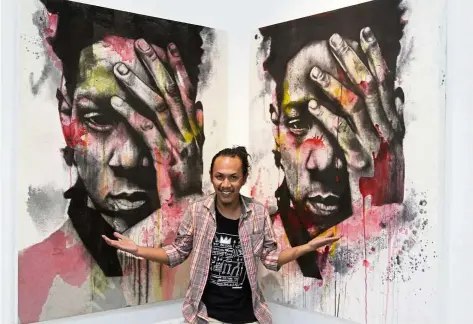  ?? — LOW BOON TAT/The Star ?? Arikwibowo posing with a work calledBL (charcoal, acrylic on linen, diptych, 2018) at his HukumAlam exhibit at Hom Art Trans.