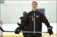  ?? CHUCK CROW — THE PLAIN DEALER ?? Monsters hockey coach Jared Bednar watches during practice at the OBM Arena in Strongsvil­le. The Colorado Avalanche have hired Bednar as their new head coach.