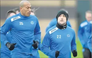  ??  ?? New Saints striker Chris Iwelumo, left, with Lee Croft.