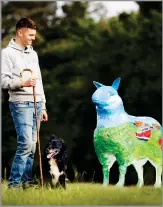  ?? ?? LEWIS RUNCIMAN of Allanshaws Farm near Galashiels, with one of the ‘Flock To The Show’ sheep sculptures