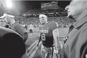  ?? BY STEVE SISNEY, THE OKLAHOMAN] [PHOTO ?? OU quarterbac­k Baker Mayfield was publicly reprimande­d by the Big 12 for his outburst on the Kansas sideline.