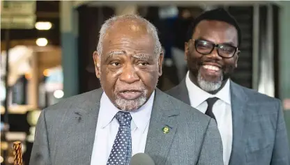  ?? ?? ABOVE: U.S. Rep. Danny Davis announces his endorsemen­t of mayoral candidate Brandon Johnson (standing behind him) at a Loop news conference Monday.