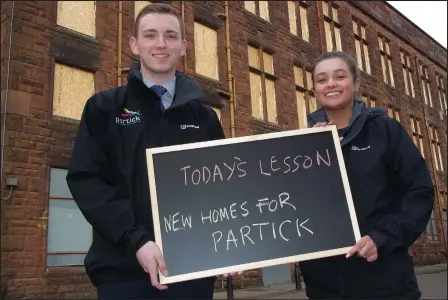  ??  ?? Partick Housing Associatio­n apprentice­s Lee Falconer and Ellie Ferguson outside the school where the new homes will be built