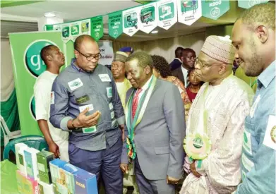  ??  ?? From left: Mr. Femi Ogundimu, Zonal Business Coordinato­r, Globacom, Northwest 1 explaining Glo products and services to
Plateau State Governor, Simon Lalong and his Deputy, Sir Joseph Ari Tyoden at the Globacom stand in the on-going
Jos Internatio­nal Trade Fair, Jos, Plateau State.
With them is Yemi Adebakin, Regionl Manager, North East 1 (far right).