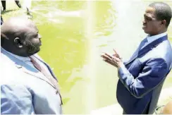  ??  ?? President Edgar Chagwa Lungu (centre) shows Economics Associatio­n of Zambia (EAZ) president Dr. Lubinda Habazooka (left) the State House fish pond. This was when Dr Habazooka and his delegation called on the President at State House yesterday. PICTURE BY SALIM HENRY/STATE HOUSE ©2018