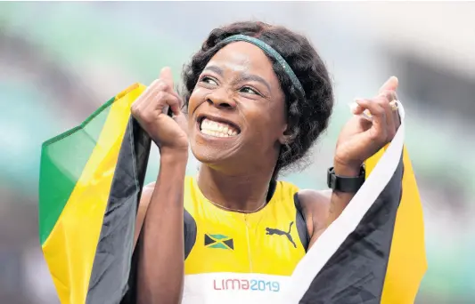  ?? MARTIN MEJIA ?? Shericka Jackson of Jamaica celebrates winning the gold medal in the women’s 400m final during the athletics competitio­n at the Pan American Games in Lima, Peru, yesterday.