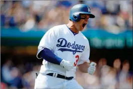  ?? ASSOCIATED PRESS ?? LOS ANGELES DODGERS’ JOC PEDERSON reacts after hitting a grand slam home run during the third inning of Monday’s game against the San Diego Padres in Los Angeles.