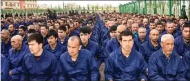  ?? ?? GENOCIDE FEARS: Uyghur Muslims in a Chinese state detention camp