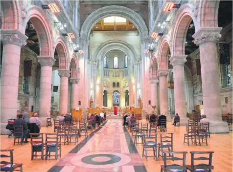  ??  ?? Faithful return:
St Anne’s Cathedral in Belfast (main picture) opens for Sunday service. Right and below: Fr Paul Armstrong at St Marys Catholic church in Chapel Lane, Belfast