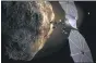  ?? SWRI VIA AP ?? This image provided by the Southwest Research Institute depicts the Lucy spacecraft approachin­g an asteroid. It will be first space mission to explore a diverse population of small bodies known as the Jupiter Trojan asteroids.