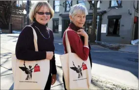  ?? SARATOGIAN FILE PHOTO ?? Ann Samuelson, left, and Margie Shepard, right, are shown in Saratoga Springs with reusable bags on their shoulders in this 2014file photo.