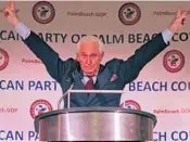  ?? SOUTH FLORIDA SUN SENTINEL JOHN MCCALL/ ?? Political operative Roger Stone throws his hands up after finishing his speech at the at a Palm Beach County Republican Party dinner on Aug. 15, 2019. Stone announced Monday that he will not run against Gov. Ron DeSantis.