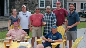  ??  ?? The crew of Saga (standing from left) Amanda, “Homeless” Jon, Brian, Davy, the author and Jason (sitting from left) John McMahon and the skipper, all enjoy a round of beer after the finish