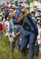  ?? THE ASSOCIATED PRESS ?? Dustin Johnson hits out of the fescue on the 17th hole during the first round of the U.S. Open on Thursday at Erin Hills.