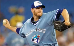  ?? 3FVUFST ?? ROY HALLADAY was a two-time Cy Young winner and eight-time All Star who pitched 12 seasons for the Toronto Blue Jays and four seasons for the Philadelph­ia Phillies. He died on Tuesday at the age of 40 when the small plane he was piloting crashed into...