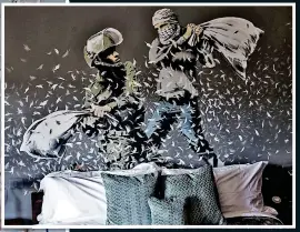  ??  ?? PROTEST ART: A Banksy piece depicts an Israeli soldier and a Palestinia­n having a pillow fight