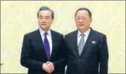  ?? AP ?? ▪ Chinese foreign minister Wang Yi (left) with his North Korean counterpar­t Ri Yong Ho in Pyongyang on Wednesday.