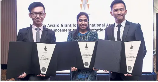  ??  ?? A day to remember: The three Merdeka Award recipients (from left) Dr Ong, Aishah and Dr Lee with their certificat­es after the event at the Petronas Twin Towers in Kuala Lumpur.