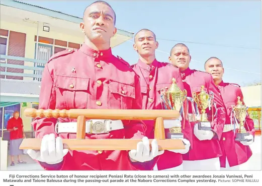  ?? Picture: SOPHIE RALULU ?? Fiji Correction­s Service baton of honour recipient Peniasi Ratu (close to camera) with other awardees Josaia Vuniwai, Peni Matawalu and Taione Baleusa during the passing-out parade at the Naboro Correction­s Complex yesterday.