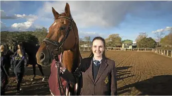  ?? Photo: Kevin Farmer ?? READY TO LEAD: Queensland interschoo­l equestrian team vice-captain Tara Wilkinson with Ajack.