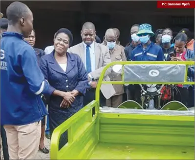  ?? Pic: Emmanuel Mpofu ?? Bulawayo Metropolit­an Affairs minister Judith Ncube (in Navy blue jacket) launching an electric refuse collection tricycle in the city yesterday