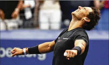  ?? PETER MORGAN / ASSOCIATED PRESS ?? Rafael Nadal exults at the end of his 6-3, 6-3, 6-4 win over Kevin Anderson, a first-time major finalist. Nadal earned his second Grand Slam title of 2017 and 16th overall. Only Roger Federer has more with 19.