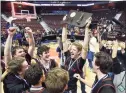  ?? Hearst Connecticu­t Media file photo ?? New Canaan celebrates after defeating Granby 55-39 in the CIAC 2019 State Boys Basketball Tournament Division IV finals at Mohegan Sun Arena in Uncasville on March 16, 2019.